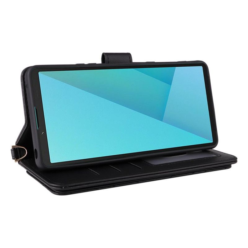 Folio-hoesje Sony Xperia 10 Vii Gewatteerd Met Riempje En Polsbandje